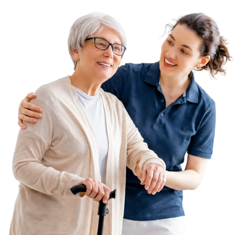 Smiling caregiver supporting an elderly woman who is walking with a cane.
